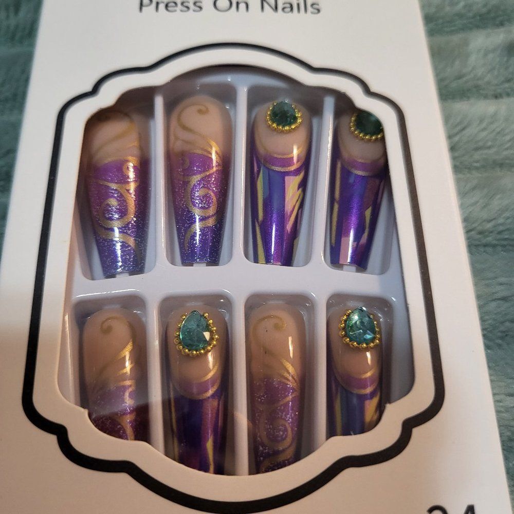 Lot of four (4) glue on nails.
